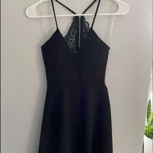 black mini dress, tight fitting at top